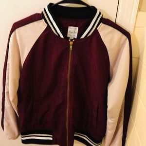 A burgundy bomber jacket